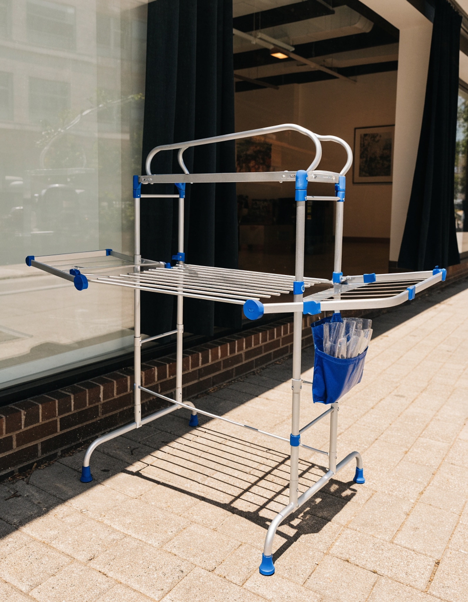 Illustrative visual for SONGMICS Clothes Drying Rack, Foldable 2-Level Laundry Drying Rack, Free-Standing Laundry Airer, with Height-Adjustable Wings, 33 Drying Rails, Sock Clips, Silver and Blue ULLR53BU