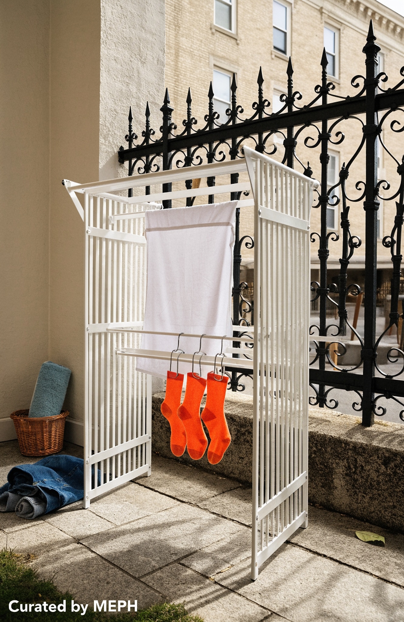 Illustrative visual for SONGMICS Clothes Drying Rack Foldable, Gullwing Laundry Drying Rack, Space-Saving, 22.2 x 68.1 x 38 Inches, Sock Clips, Metal Structure, for Clothes, Towels, Linens, Indoor, Outdoor White ULLR518W01