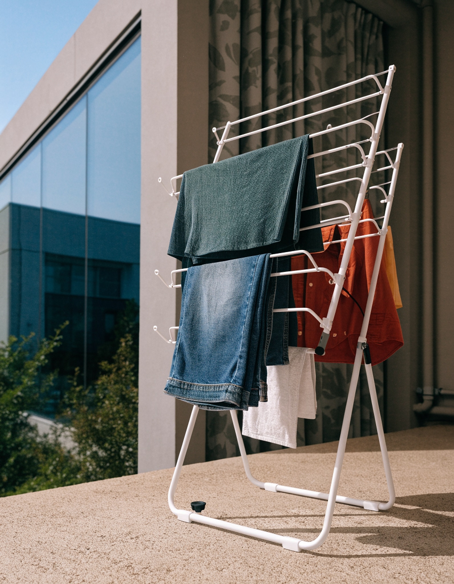 Illustrative visual for Amazon Basics Foldable Portable Laundry Drying Rack for Air Drying Clothing, Indoor Outdoor Use - 29.4 x 14.8 x 41.9 inches (LxWxH), White