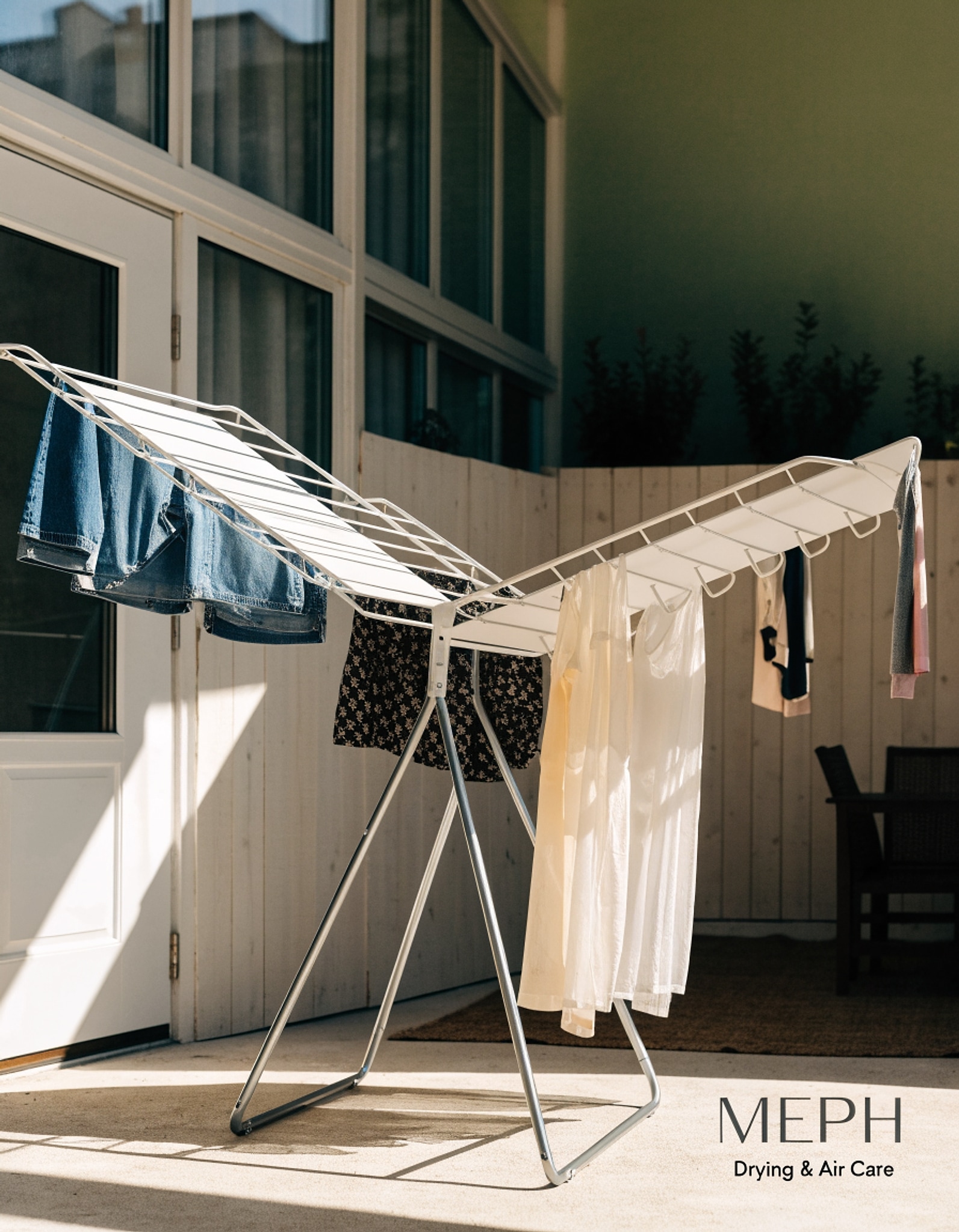 Illustrative visual for Amazon Basics Foldable 4-Wing Metal Clothes Drying Rack, 61x23.6x49.6 inches, White